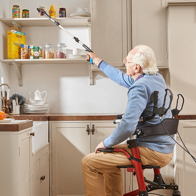 Man using a kekoy reacher support fetching things in a cabinet