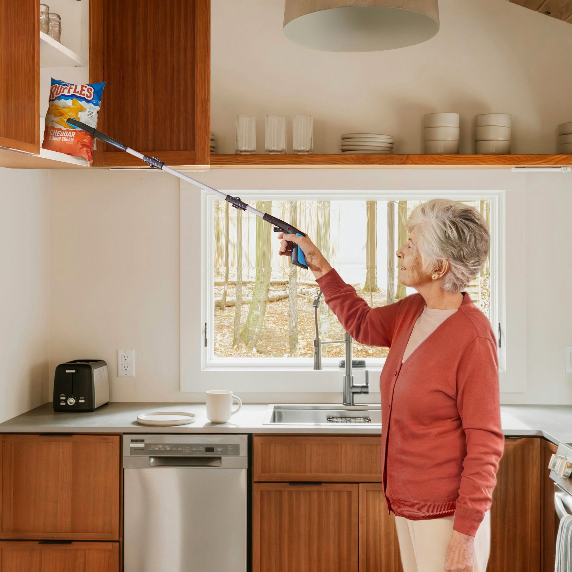 Woman using a kekoy reacher tool for things in a high cabinet