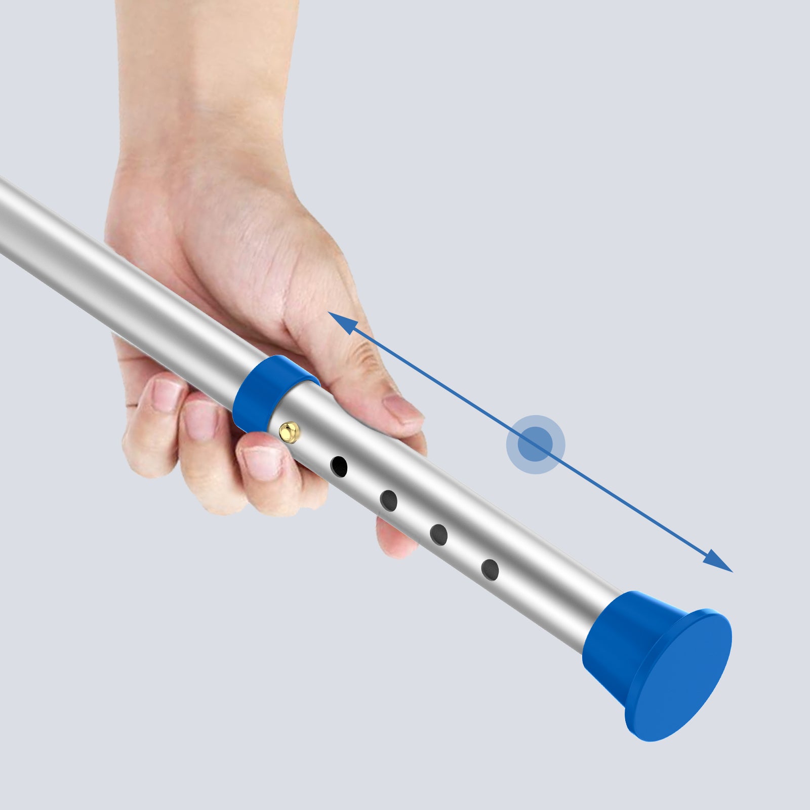 Hand holding a metal rod to adjust length