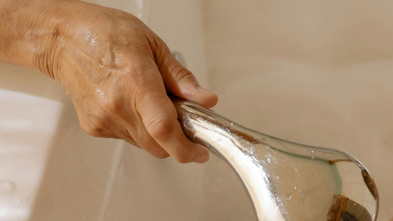 elder with shower head